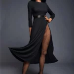 Alicie Sex Doll 168 cm IronTech en robe noire, pose élégante, cheveux longs, jambes croisées.