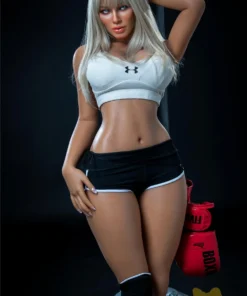 Alizée Sex Doll 164 cm IronTech en tenue de sport, posant avec un sac de boxe.